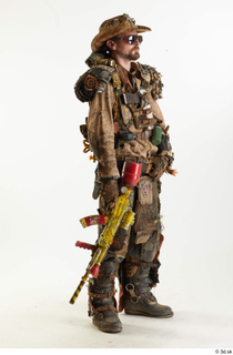 Ryan Miles in Junk Town Postapocalyptic Bobby Suit holding gun…